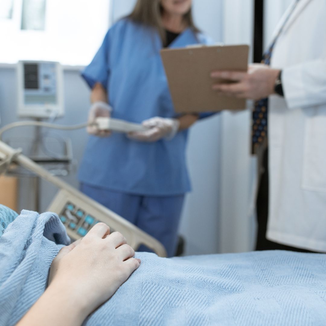 Doctor and nurse reviewing patient data